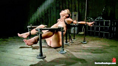 Bound blonde beauty with huge boobs in painful BDSM restraint