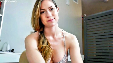 Smiling curvy brunette with big tits in sheer bra exposing hard nipples