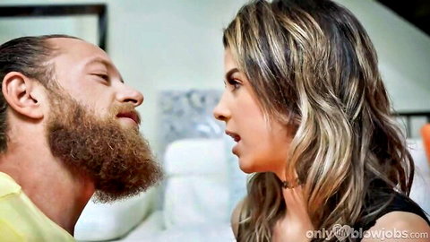 Bearded man faces busty brunette in low-cut top during intimate closeup moment