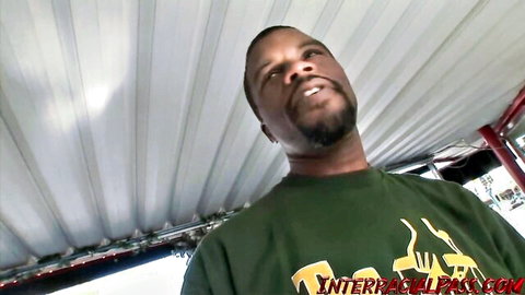 Handsome black BBC stud with goatee smirking up in green Interracial Pass shirt