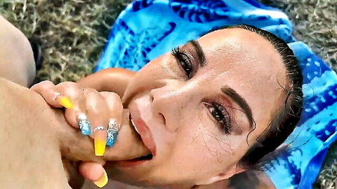 Queen Rouge sucking fingers passionately outdoors in blue bikini