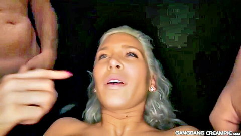 Blonde petite with small tits surrounded by men's hands in rough gangbang creampie