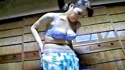 Japanese MILF in purple lacy bra and pajama bottoms, seductive pose
