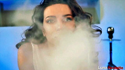 Luna Roulette smoking hookah sensually, blue eyes and wavy brunette hair