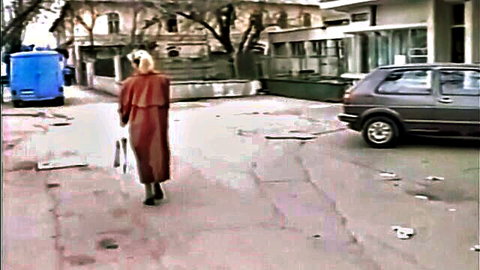 Vintage blonde in red coat walking outdoors, Kisses from Romania classic porn thumbnail