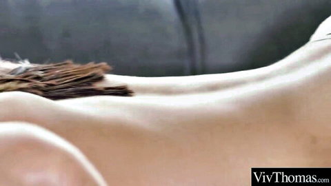 Curvy fair-skinned babe's naked ass and smooth back teased with feathers