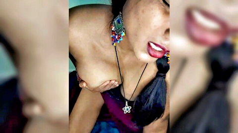 Punam Baby1 seductive Indian babe flashing cleavage with bold jewelry and red lips