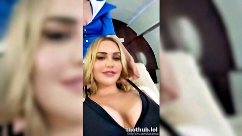 Blonde Mia Malkova in low-cut black dress showing cleavage, Lana Rhoades in blue uniform nearby