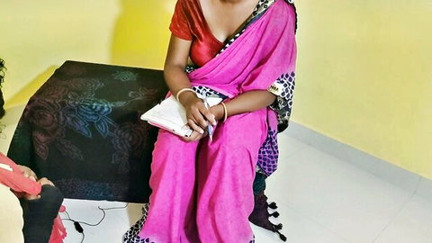 Seductive Indian woman in pink saree with deep cleavage