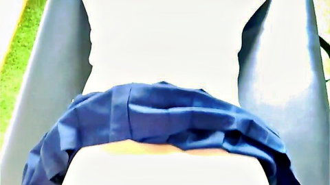 Woman on massage table with blue pants pulled down, exposing round ass for erotic rubdown