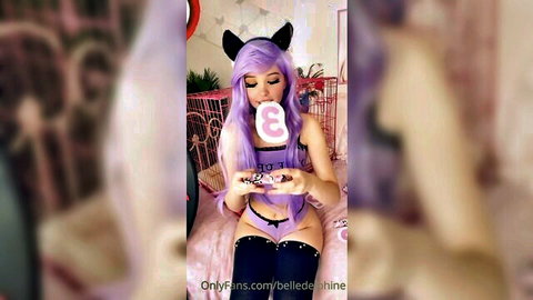 E-girl Belle Delphine in purple lingerie holds pink dildo over black thong teasing tight pussy