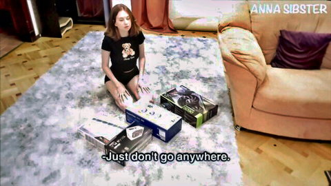 Cute Anna Sister kneels teasingly in crop top and shorts surrounded by NVIDIA GPU boxes begging you to stay