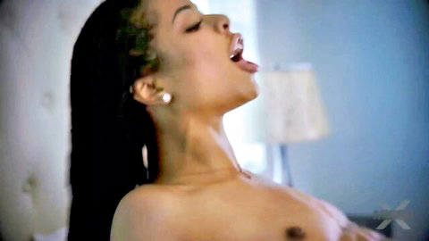 Kira Noir topless in ecstasy, wet black hair, open mouth pleasure