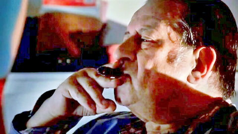 Vintage mature man in shirt sucking object in car close-up
