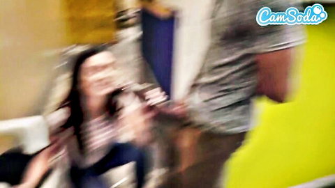 Blurry Asian woman giving public blowjob to black man in grocery store
