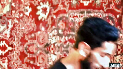 Bearded South Asian man in black shirt, side profile on rug, Raj Ram Sivan hookah bros
