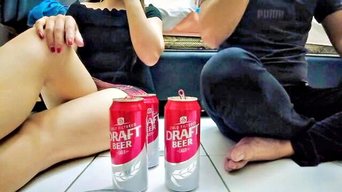 Petite Asian girl in skirt and friend with beer cans, teaser for homemade Indonesian pussy video