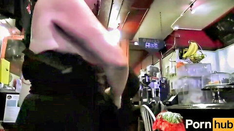 Amateur MILF topless from behind in black skirt, teasing in kitchen