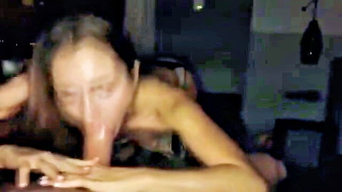 Blurry amateur Asian wife giving intense blowjob in dim light