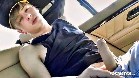 Young blonde twink reclines in car seat with big uncut cock exposed pants down