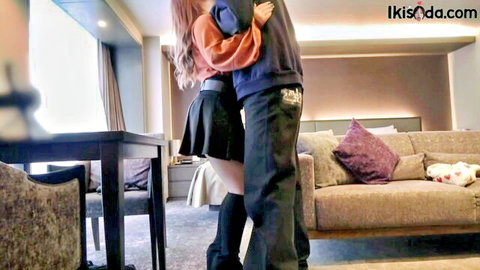 Short Japanese girl with big breasts hugged from behind in skirt and stockings
