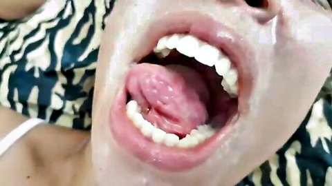 Brazilian girl opens mouth wide with tongue out in lesbian spit fetish