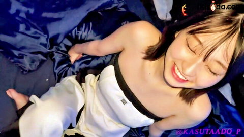 Foxy-eyed Asian beauty smiles in bed on first date, raw sex teaser