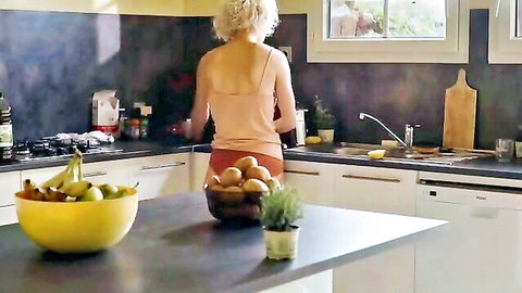 Claudia Fortunato bending over in kitchen, blonde showing curvy ass in Vortex (2019)