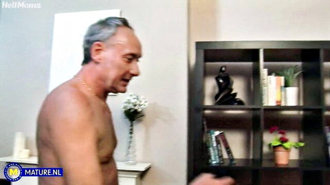 Shirtless mature man with gray hair in intimate MILF scene