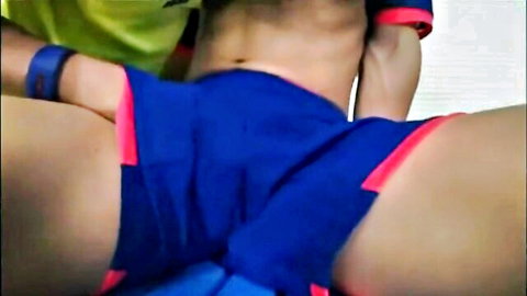 Oriental soccer nubile in tight blue shorts spreading legs teasing