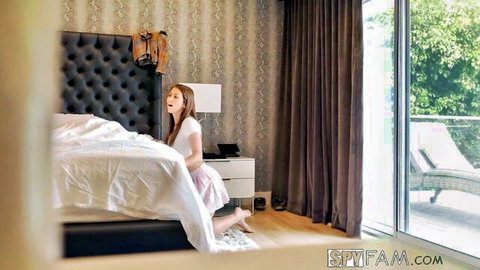 Skinny young brunette stepsister kneeling moaning in bedroom with open mouth and pink skirt hiked up