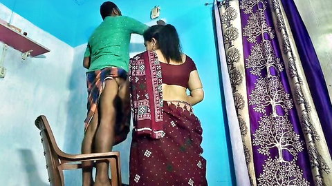 Indian housewife in red saree gropes husband's bare ass while he fixes light on chair homemade amateur
