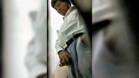 Older man exposing cock in public toilet, blurry close-up