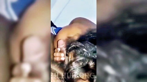 Sexy Sri Lankan woman with wet black hair in blue top, intimate close-up