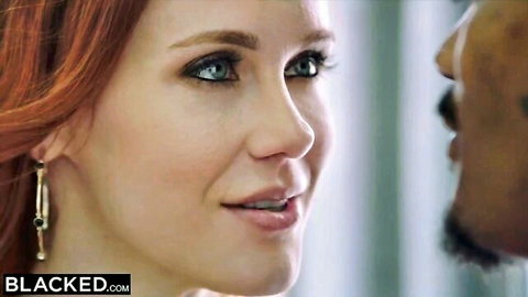 Maitland Ward redhead close-up gazing at BBC partner in interracial scene