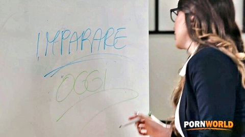 Asian woman in glasses and blazer discussing ideas on whiteboard