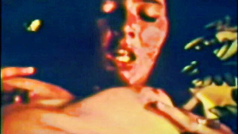 Vintage 60s porn actress with intense ecstatic expression, close-up