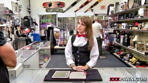 Brunette card dealer in uniform at pawn shop counter