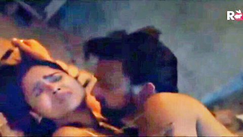 Desi Indian bhabhi in passionate embrace with lover, exposed breasts in hot web series scene