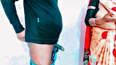 Indian step-aunt in red saree stands by exposed young man's cock