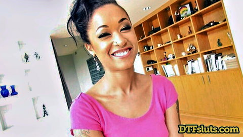 Smiling skinny brunette with small tits and tattoos in tight pink tank top