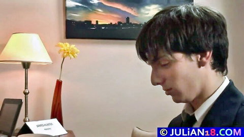 Handsome young twink in suit at desk, gay mature cock play preview