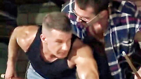 Two muscular white truckers in close embrace during hot orgy
