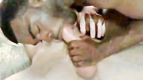 Interracial bareback scene: Black man performing oral on white woman, cum on thigh