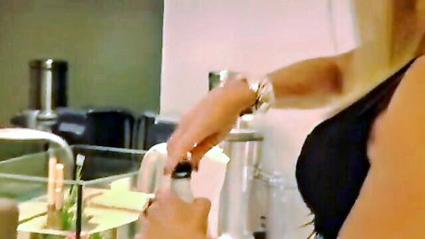 Busty blonde MILF teasing huge tits cleavage while holding lotion bottle over sink