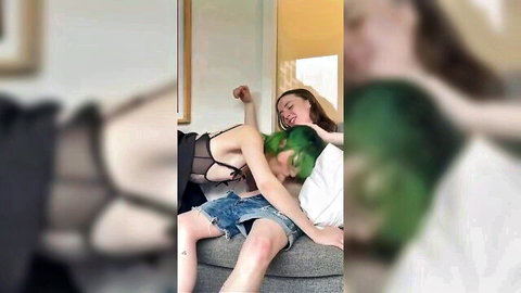 Homemade trans orgy thumbnail: two slim trans women in black lingerie and denim shorts, green-haired model cuddling intimately