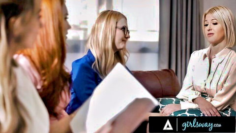 Two blondes and redhead beauty sitting on couch reviewing papers in classroom lesbian threesome setup