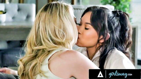Blonde stepmom passionately kisses Asian stepdaughter in teasing embrace