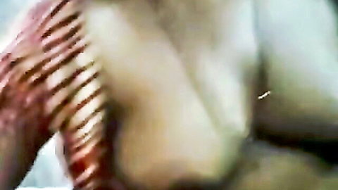Busty Indian MILF's massive oiled tits with erect dark nipples in extreme closeup