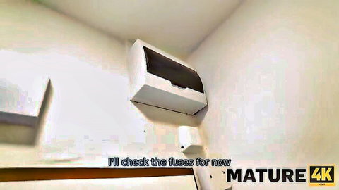 Mature 4K video frame of empty room corner with white fuse box on wall